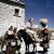 Foto Nara: un’ausiliaria americana conversa con alcune contadine in abito tradizionale di un villaggio dell’Appennino, Aiello del Sabato (Av), 1944