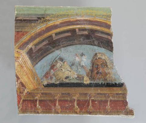 “Frammento di decorazione parietale ad affresco: lunetta con maschera e attributi di ercole”, ca. 50-30 a.C., secondo stile pompeiano, h cm 61, largh cm 81 –  Antiquarium di Boscoreale (NA) - Parco Archeologico di Pompei